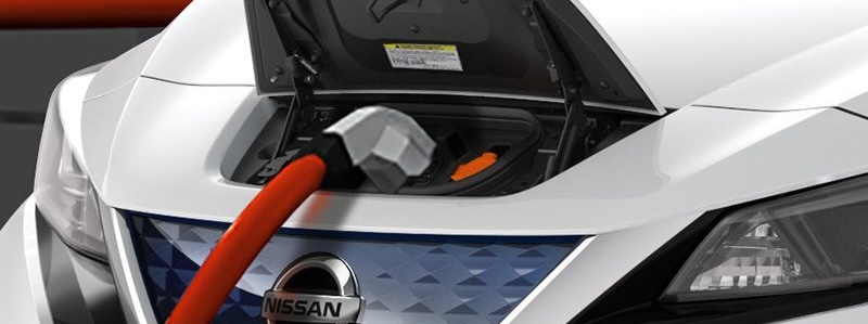 Nissan electric car connected to a solar-powered home charger