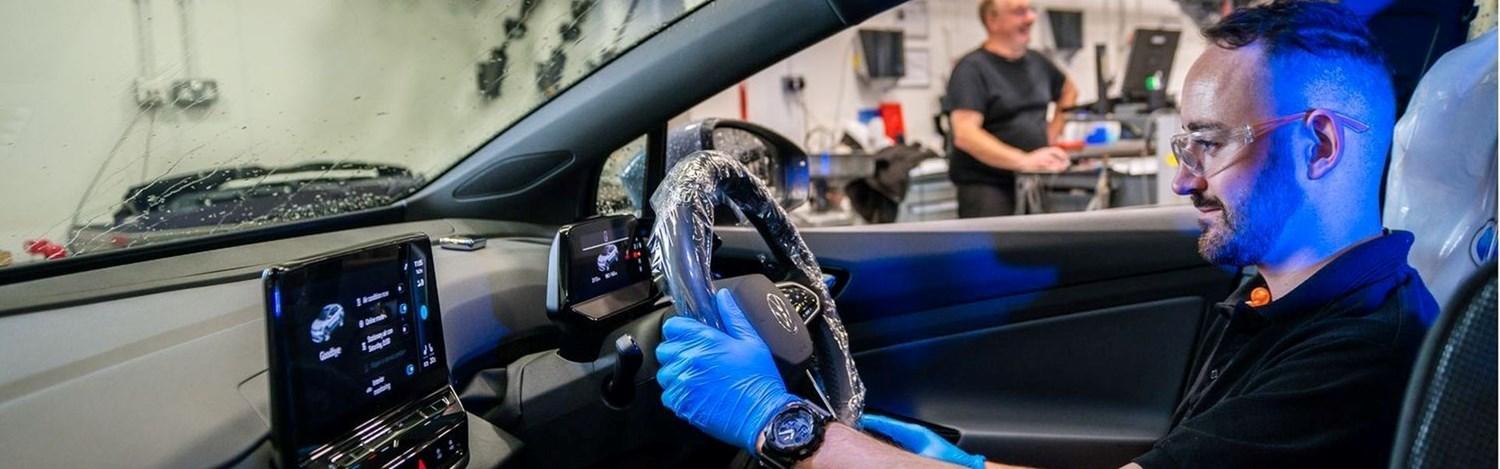 Volkswagen Service Specialist tests steering wheel of used Volkswagen Golf during service at the Volkswagen Approved Accident Repair Centre, Agnew Volkswagen Mallusk