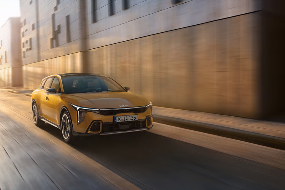 kia k4 on the road