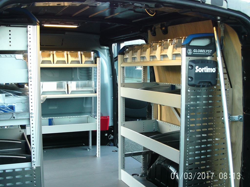 Work van interior with Sortimo racking, shelving and small parts bins along both sides.