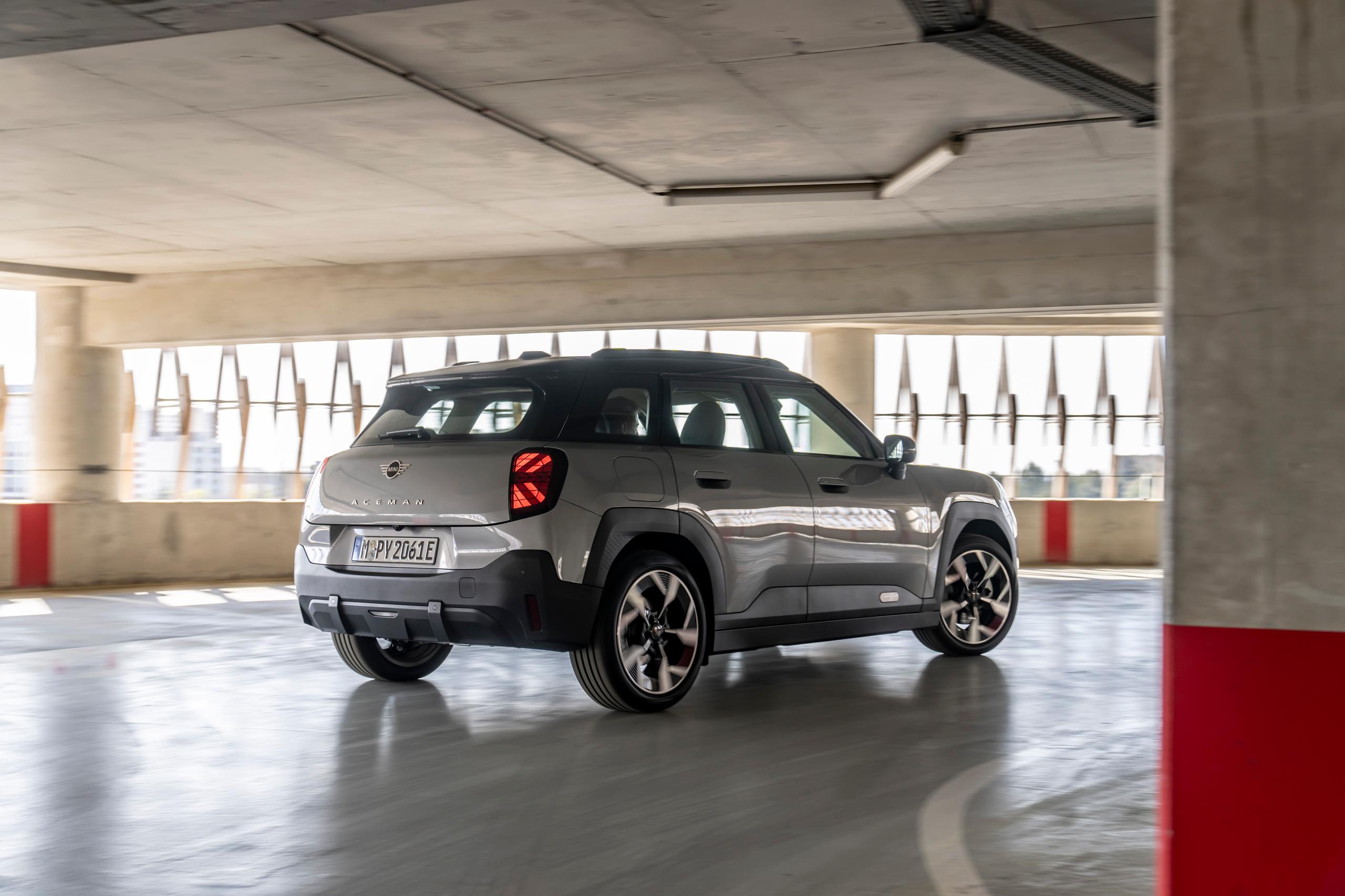 Electric and Hybrid MINI Aceman driving in Car Park in Northern Ireland