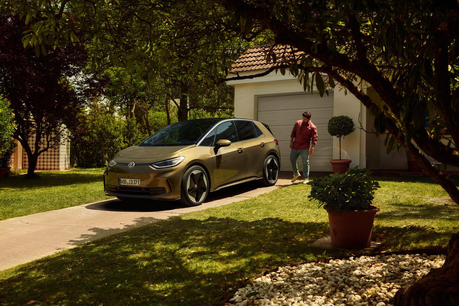 Front and side view of the new Volkswagen ID.3 in gold, parked outside home