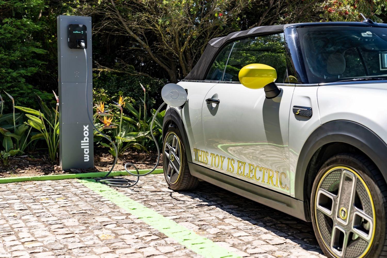 MINI Electric parked and charging at an electric charging point