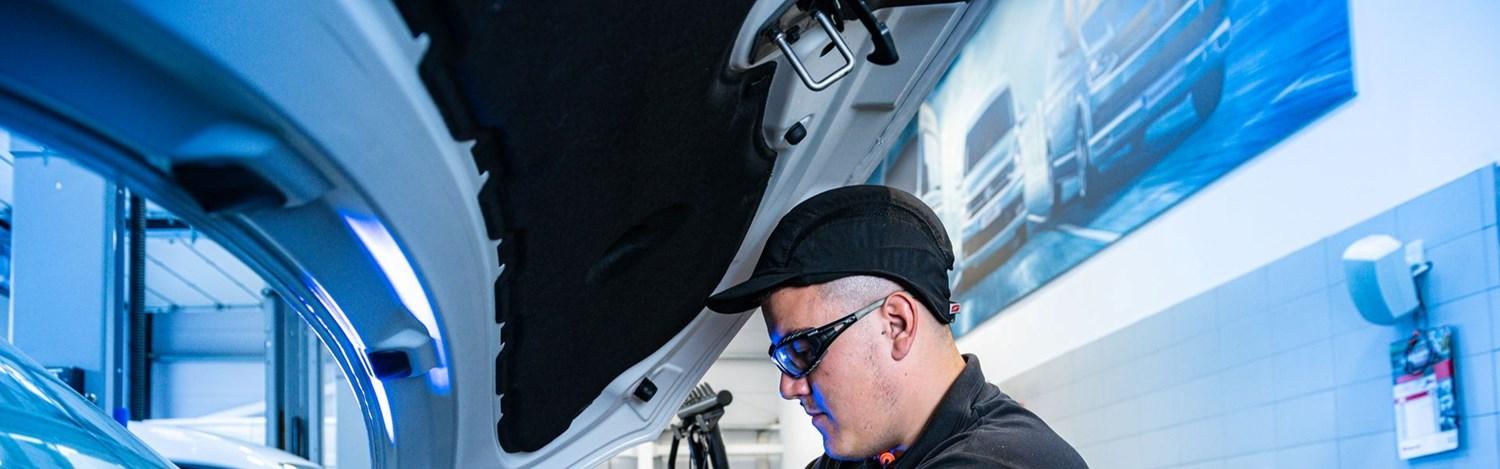 Volkswagen Service Specialist makes under the hood repairs to Volkswagen Commercial Vehicle at Volkswagen Approved Repair Centre at Agnew Van Centre, Mallusk