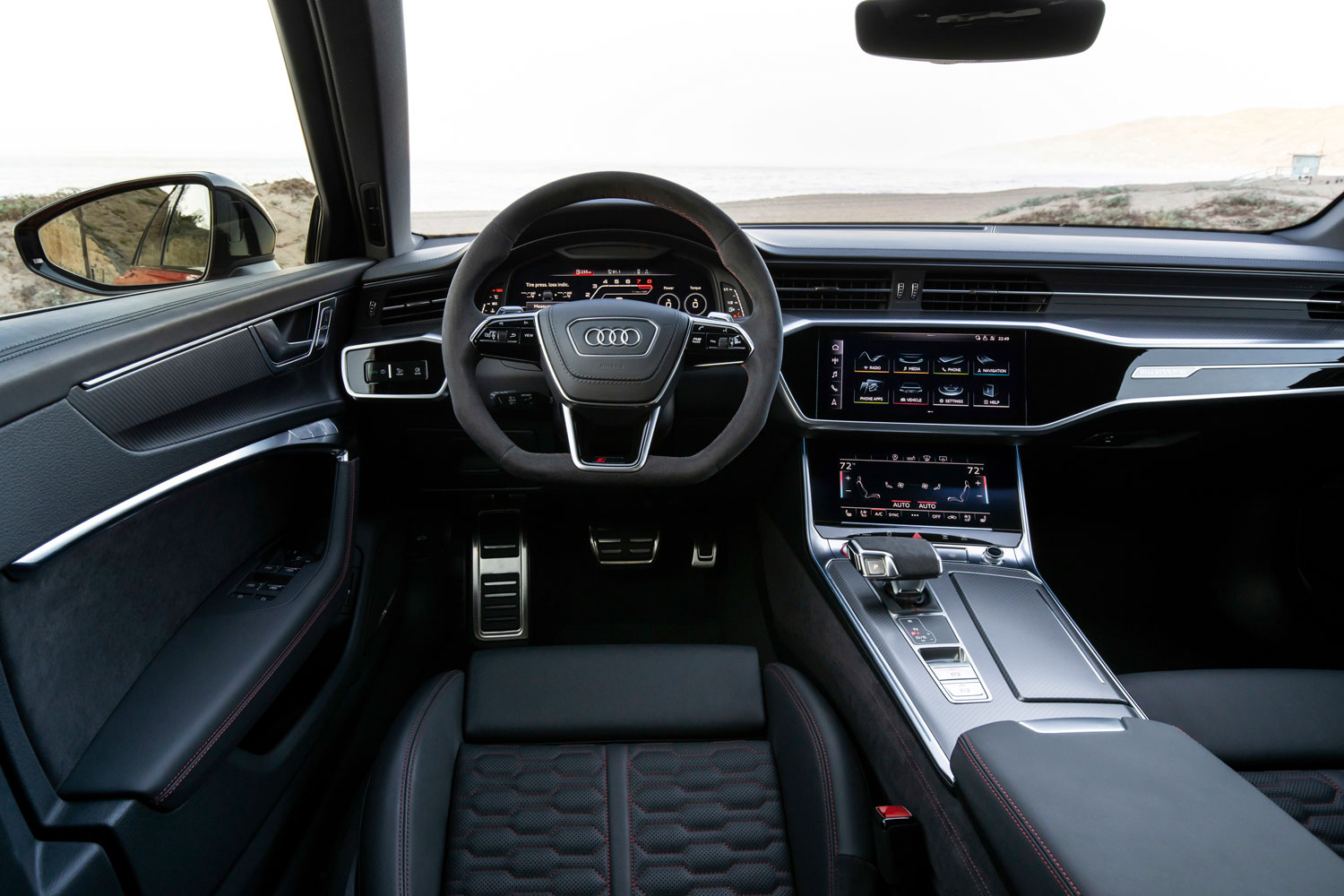 New Audi RS6 Avant interior front view of drivers side, focusing on the infotainment system