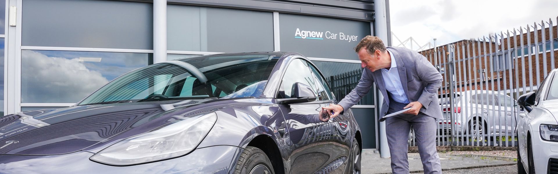 Agnew Car Buyer Specialist completes final checks on Tesla before making a decision around purchasing the vehicle