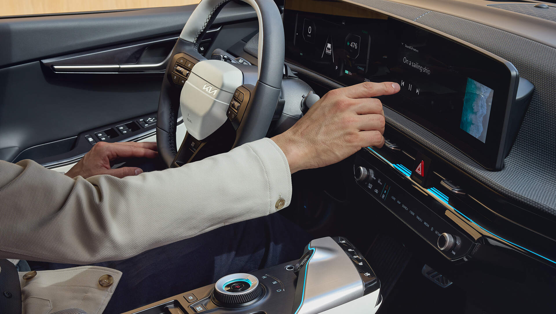 person operating the infotainment of kia EV6