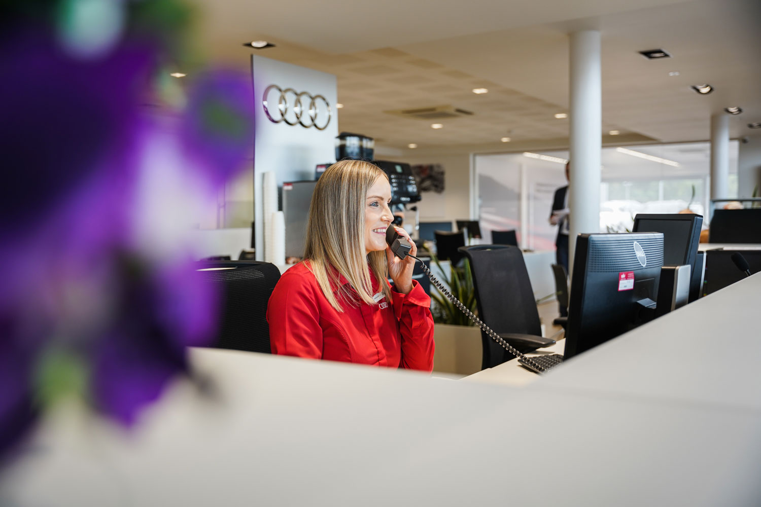 Audi Customer Service Specialist answers customers phone call at Belfast Audi