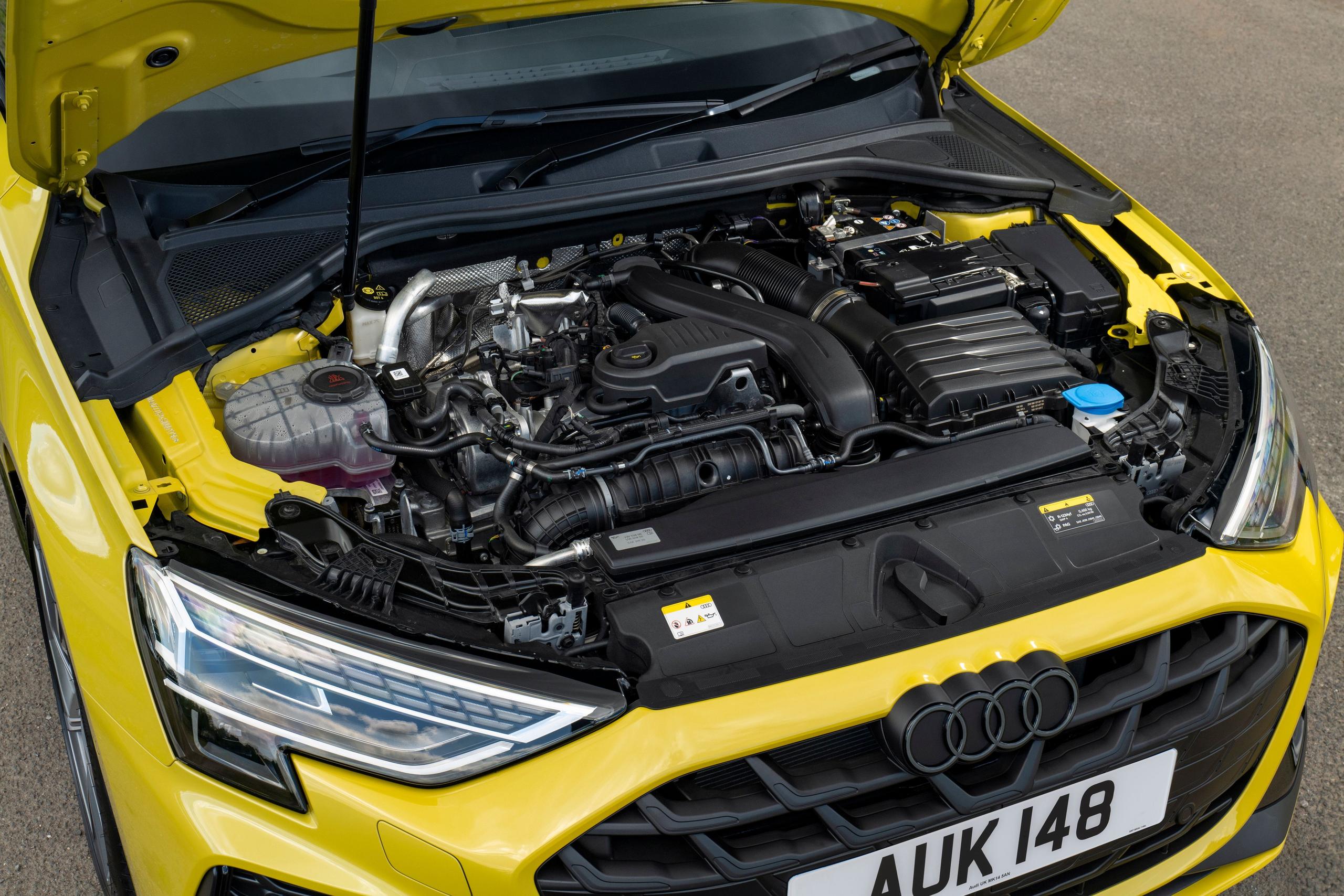 Under the hood of an Audi after the battery is checked