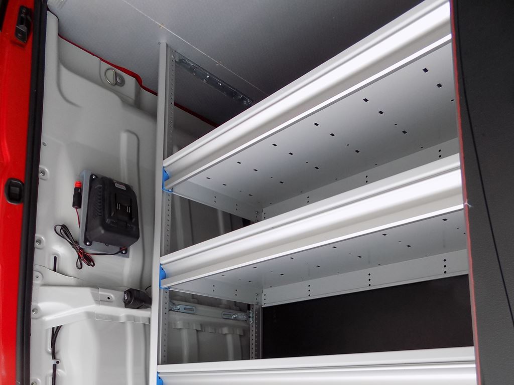 Side view of van shelving system with multiple storage levels and racking supports.