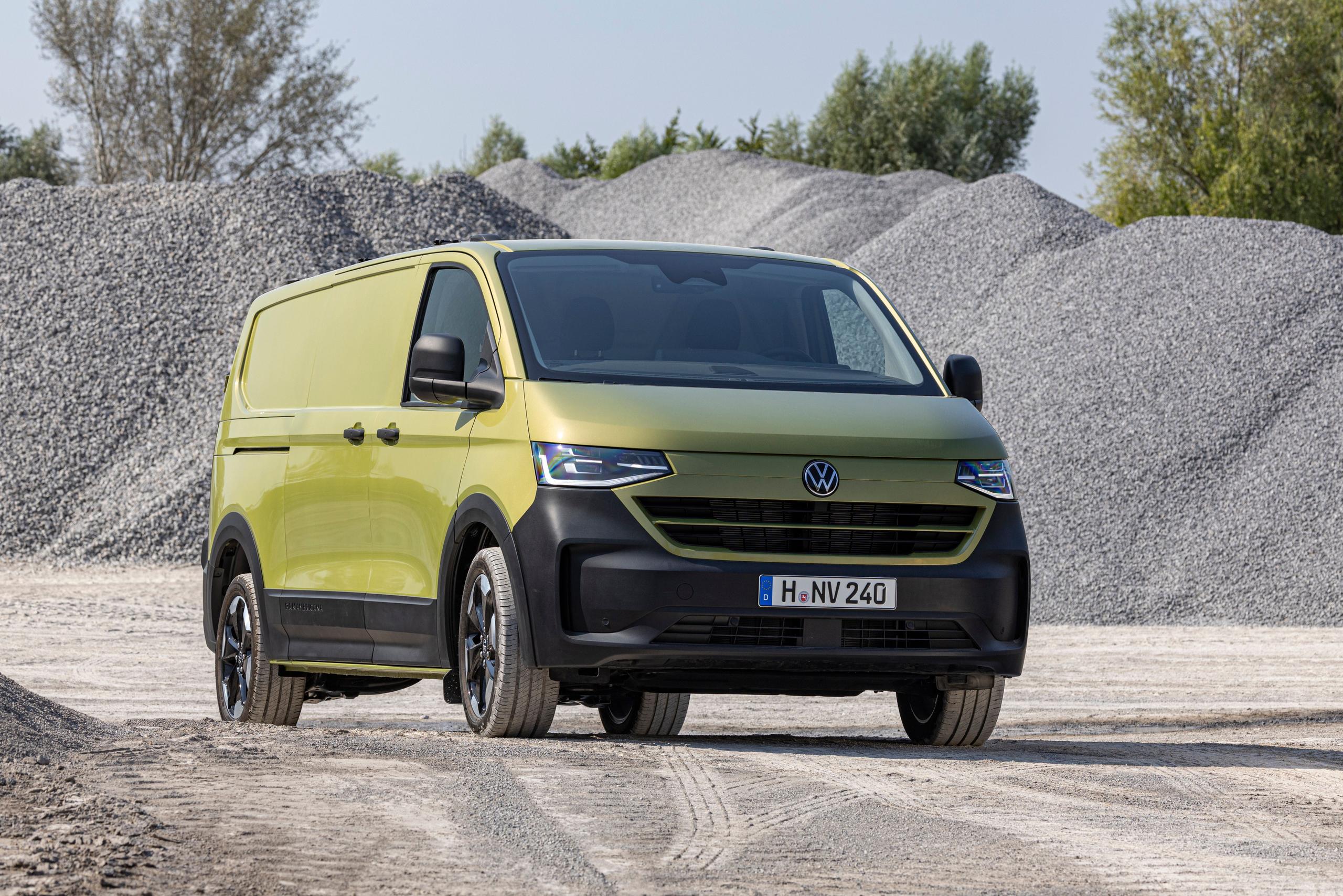 The All-New Volkswagen Transporter (2025) in green, driving around gravel site