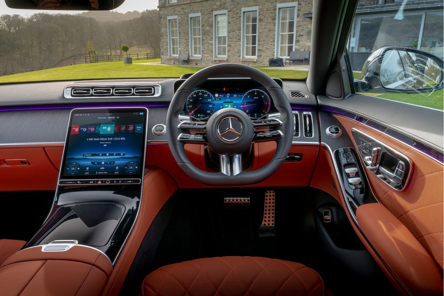 Mercedes-Benz S-Class Saloon tan interior with a black steering wheel and two displays.