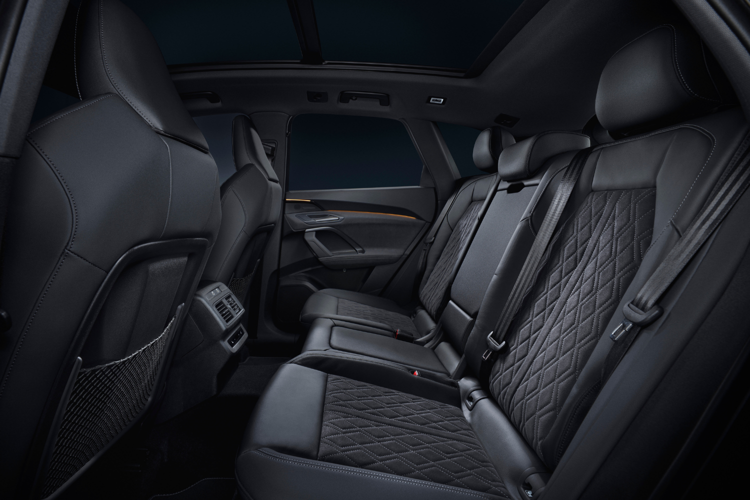 The new 2024 Audi Q5 black leather interior passenger seats.