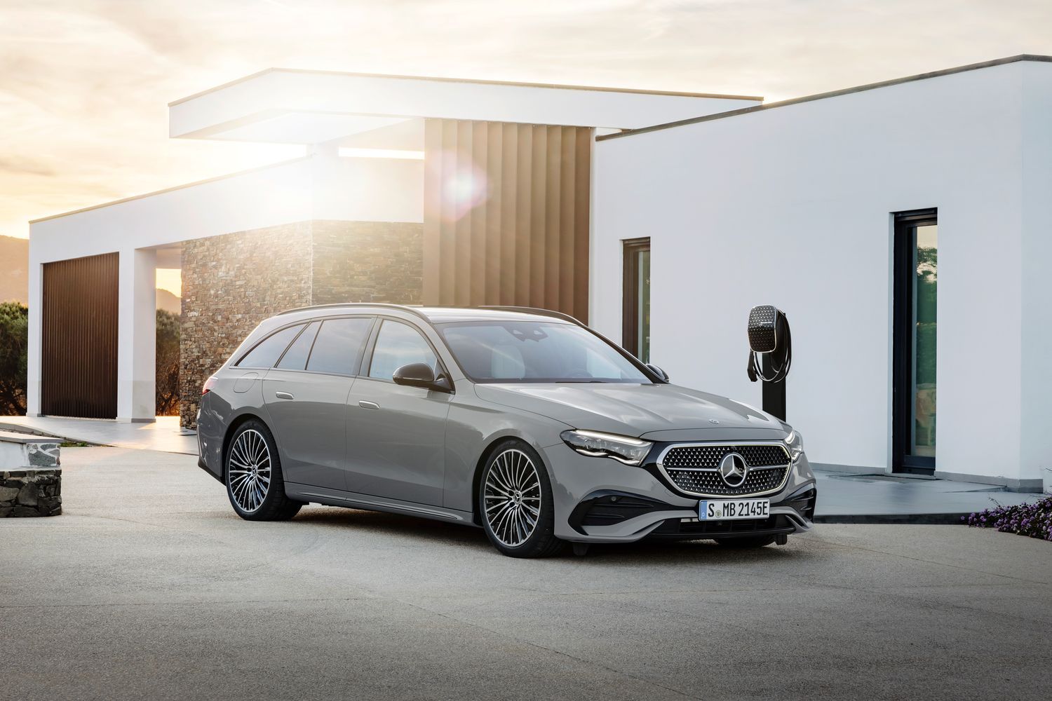 A parked silver Mercedes-Benz E-Class Estate.