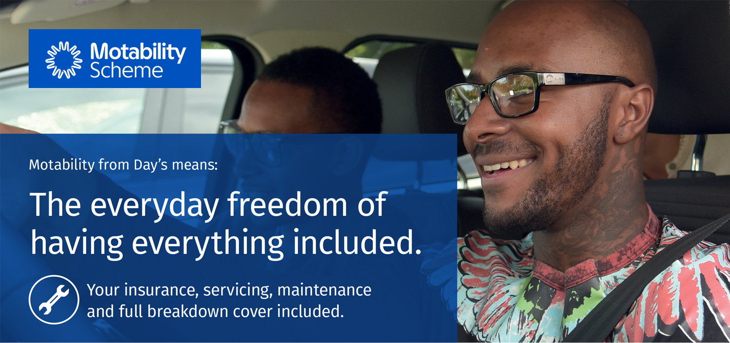 Motability scheme image man with glasses driving car