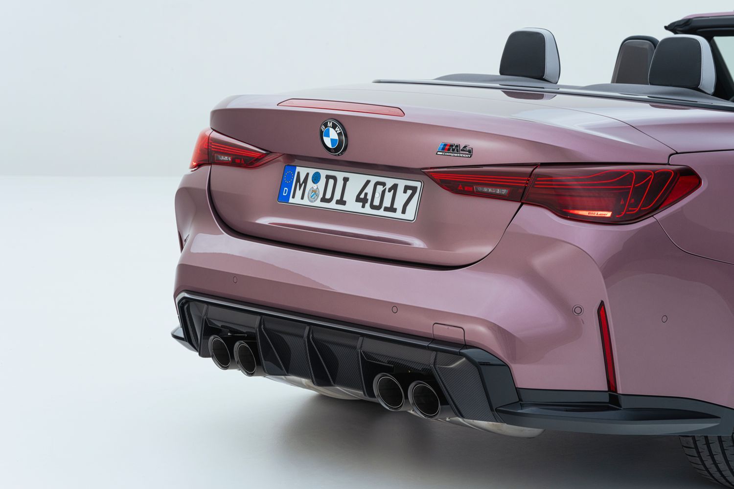 Rear view of the BMW M4 Competition Convertible in purple