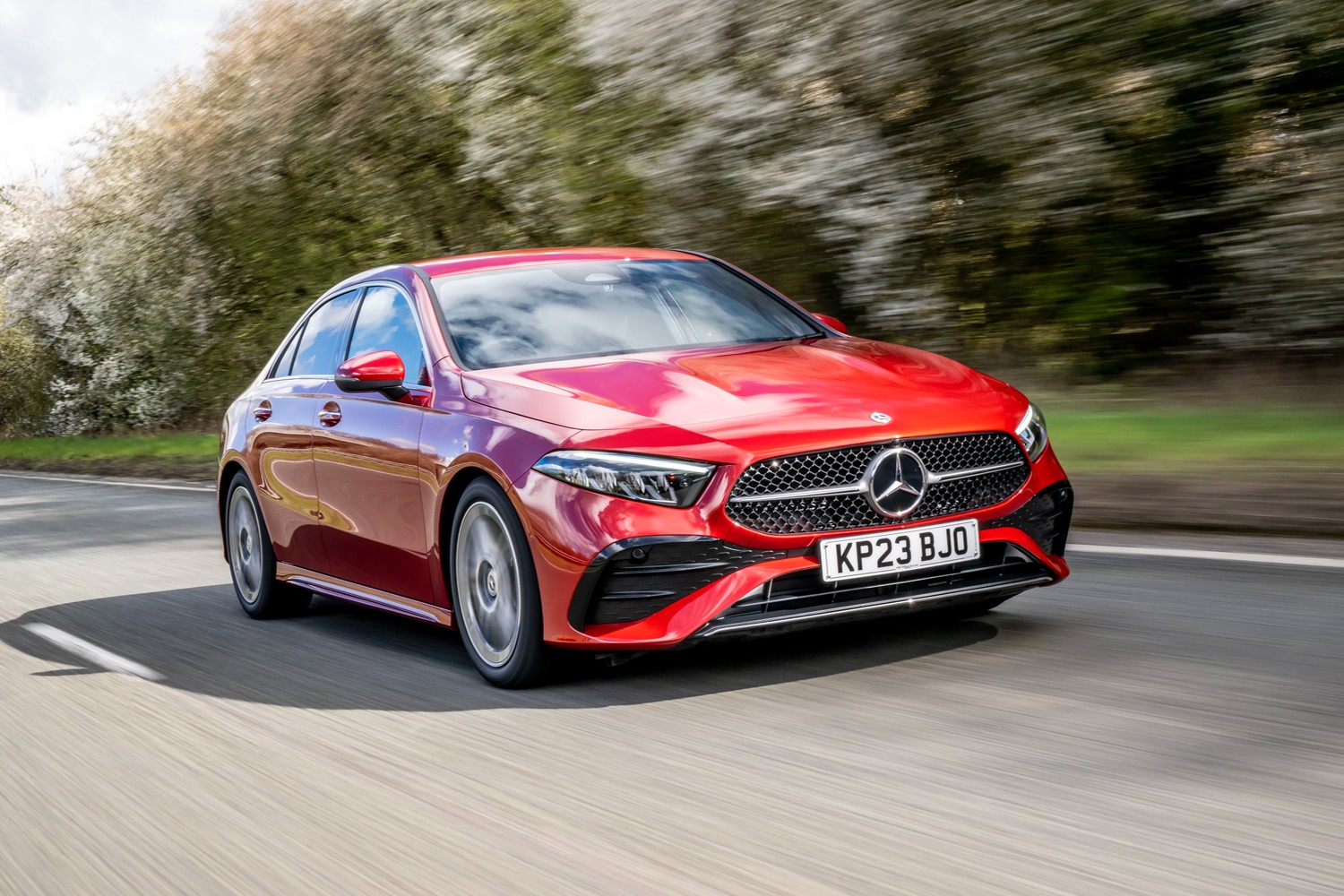 Red A Class Saloon front view driving image