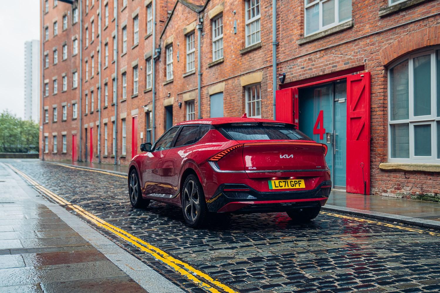 Red EV6 parked outside on a cobbled street