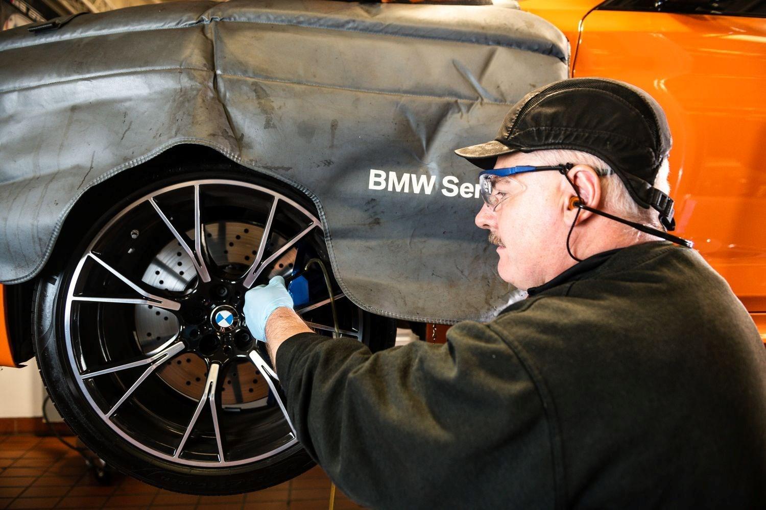 BMW Technician makes alloy wheel repair to BMW vehicle at Bavarian BMW Belfast
