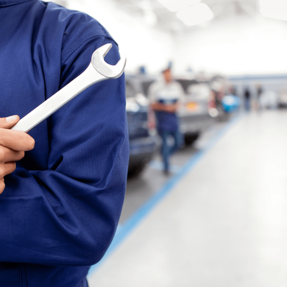 Mechanic with a spanner in a workshop