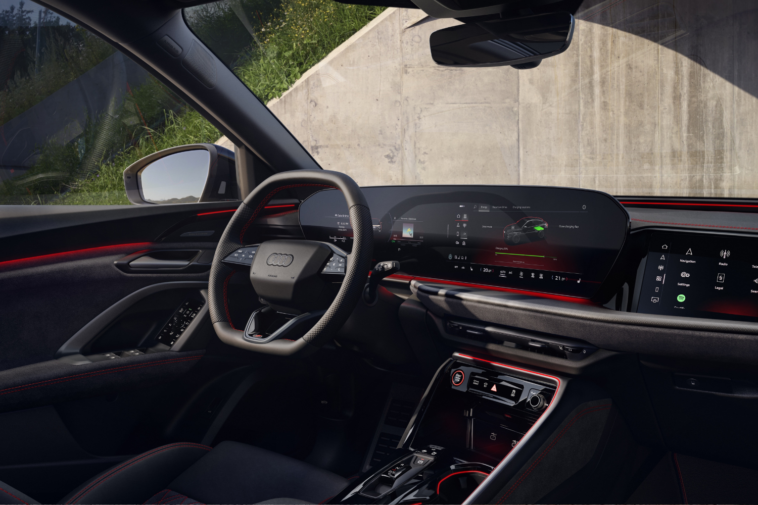 Close up of the new Audi Q5 e-hybrid black and red interior, featuring the MMI experience plus infotainment system.