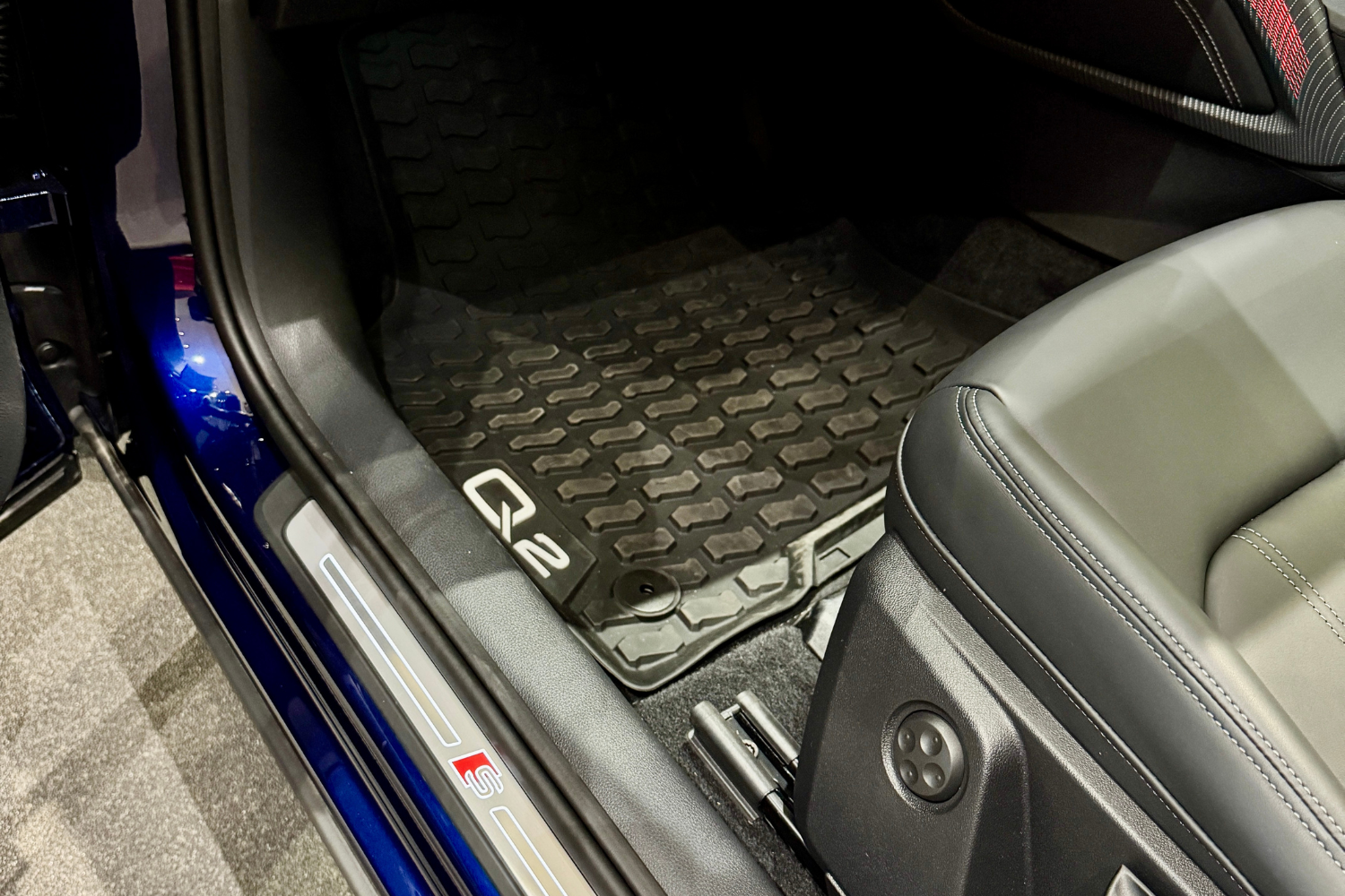 Close up of an Audi Q2 passengers side floor mats.