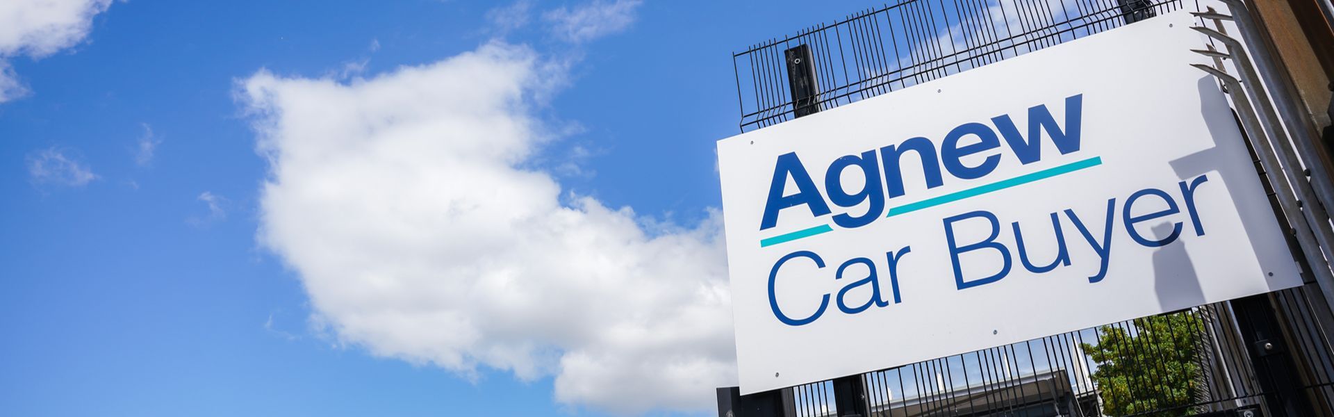 Close-up of the external signage for Agnew Car Buyer