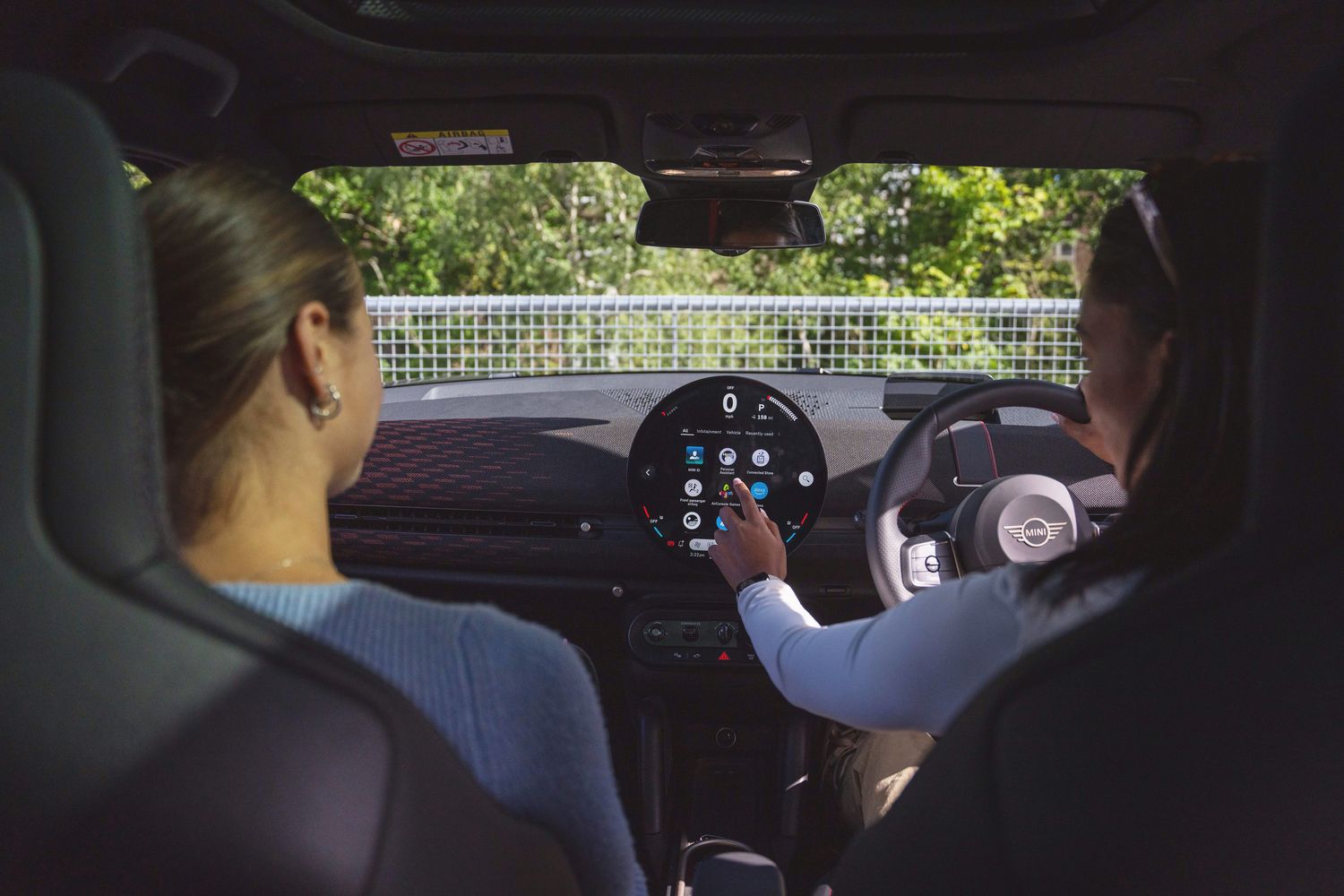 The interior of the new all-electric MINI Aceman with circular OLED display screen.