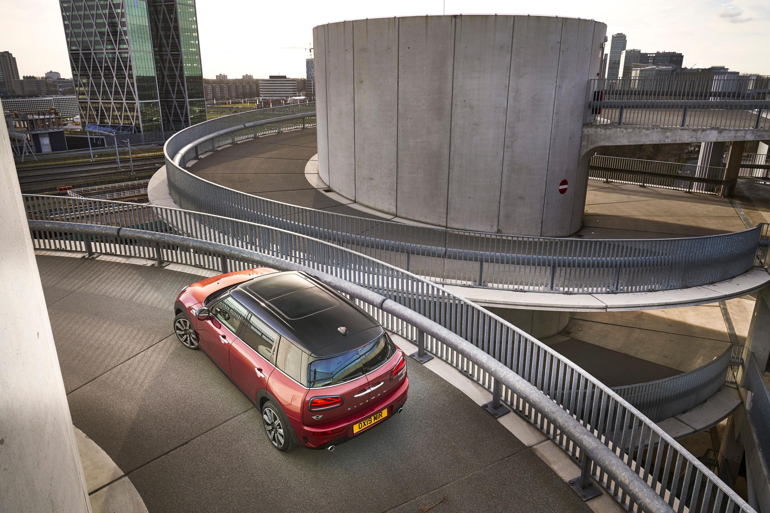 Aerial view of the new MINI Clubman in red,, driving up ramp to go to the top floor of car park