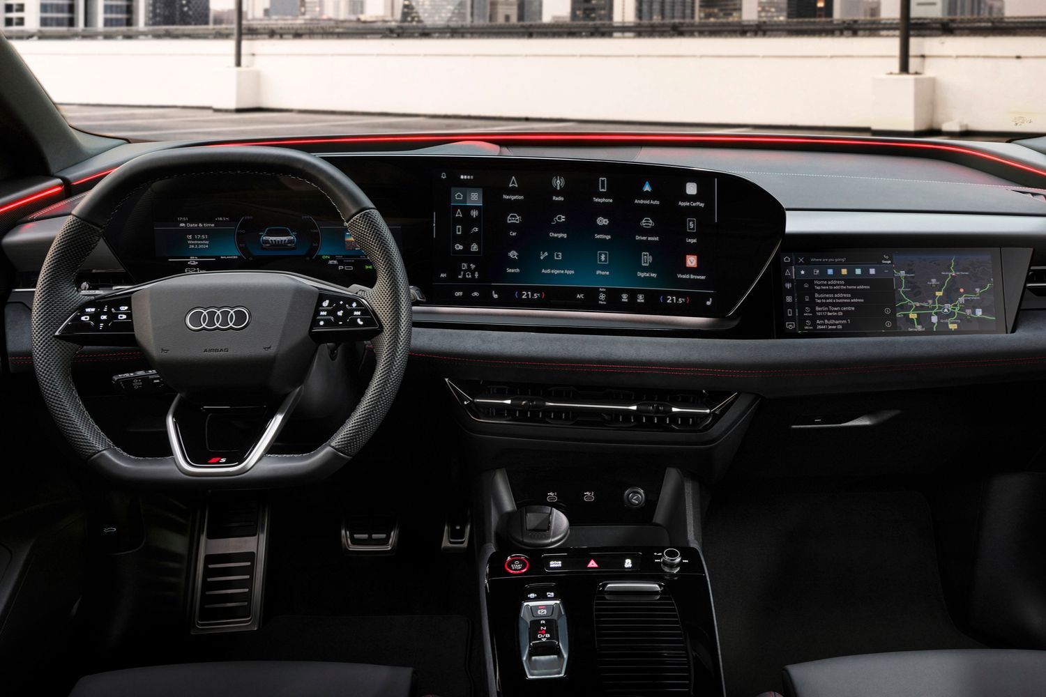 Close up of the Audi SQ6 e-tron's curved 14.5-inch panoramic display and 10.9-inch passenger display. 