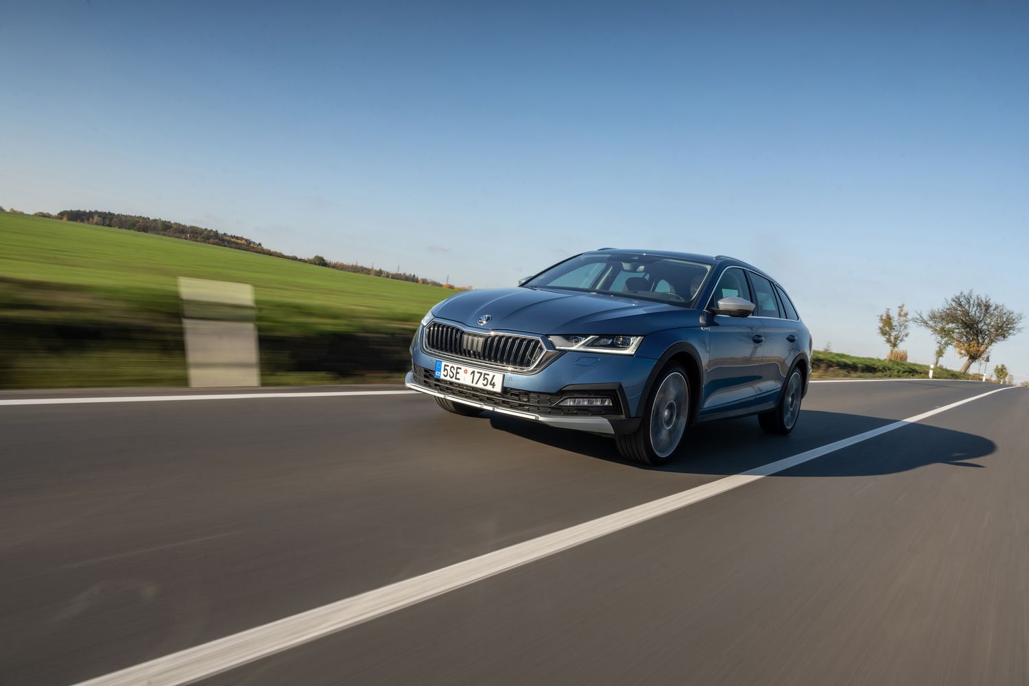 The new Skoda Octavia Estate, driving on country road.