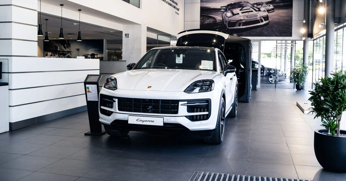 Porsche Cayenne parked in dealership showroom