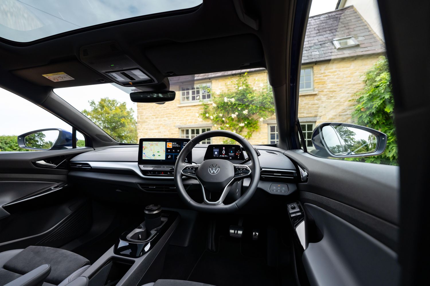 Interior view of the new Volkswagen ID.4, close-up from driver-side of the steering wheel and infotainment system