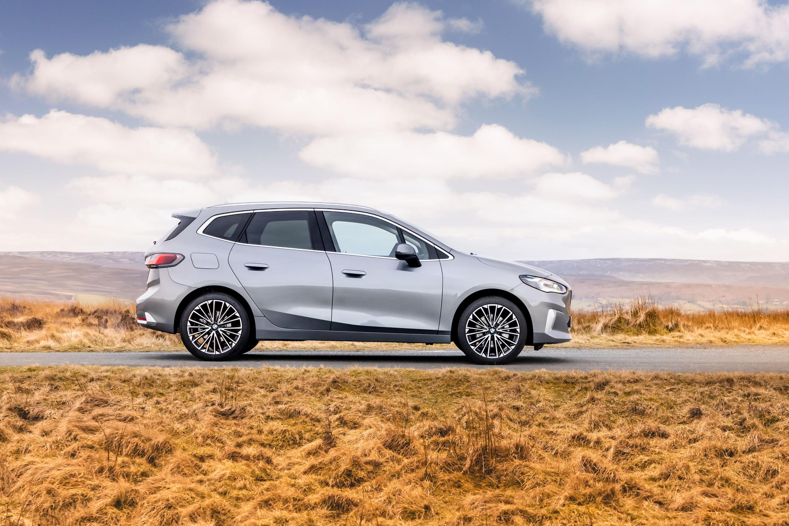New BMW 2 Series in silver, side view image of vehicle parked on a road