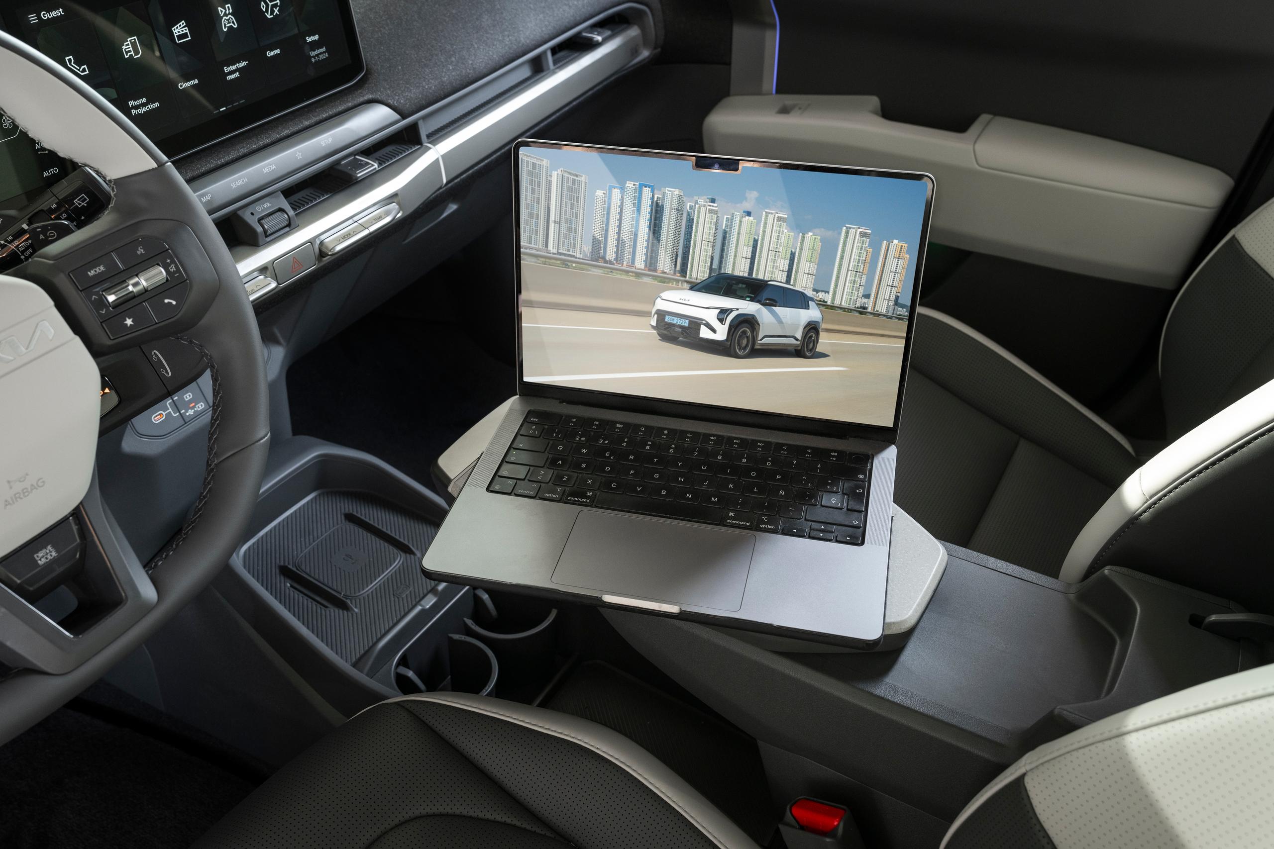 Kia EV3 charging a laptop