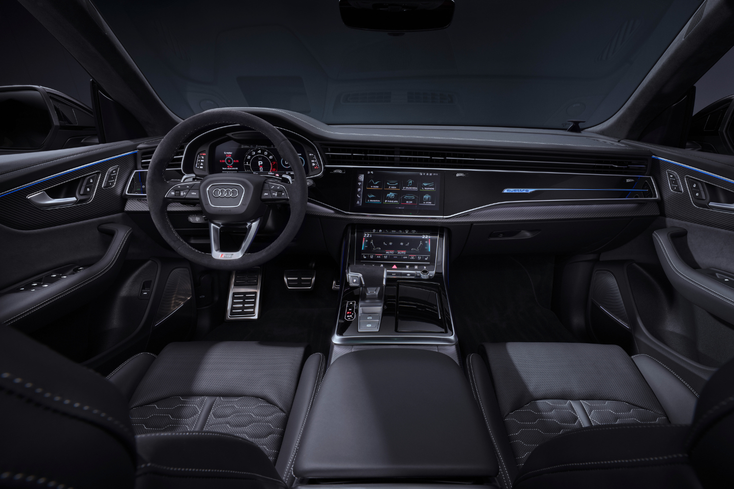 Audi RS Q8's black interior, steering wheel and three driver displays.