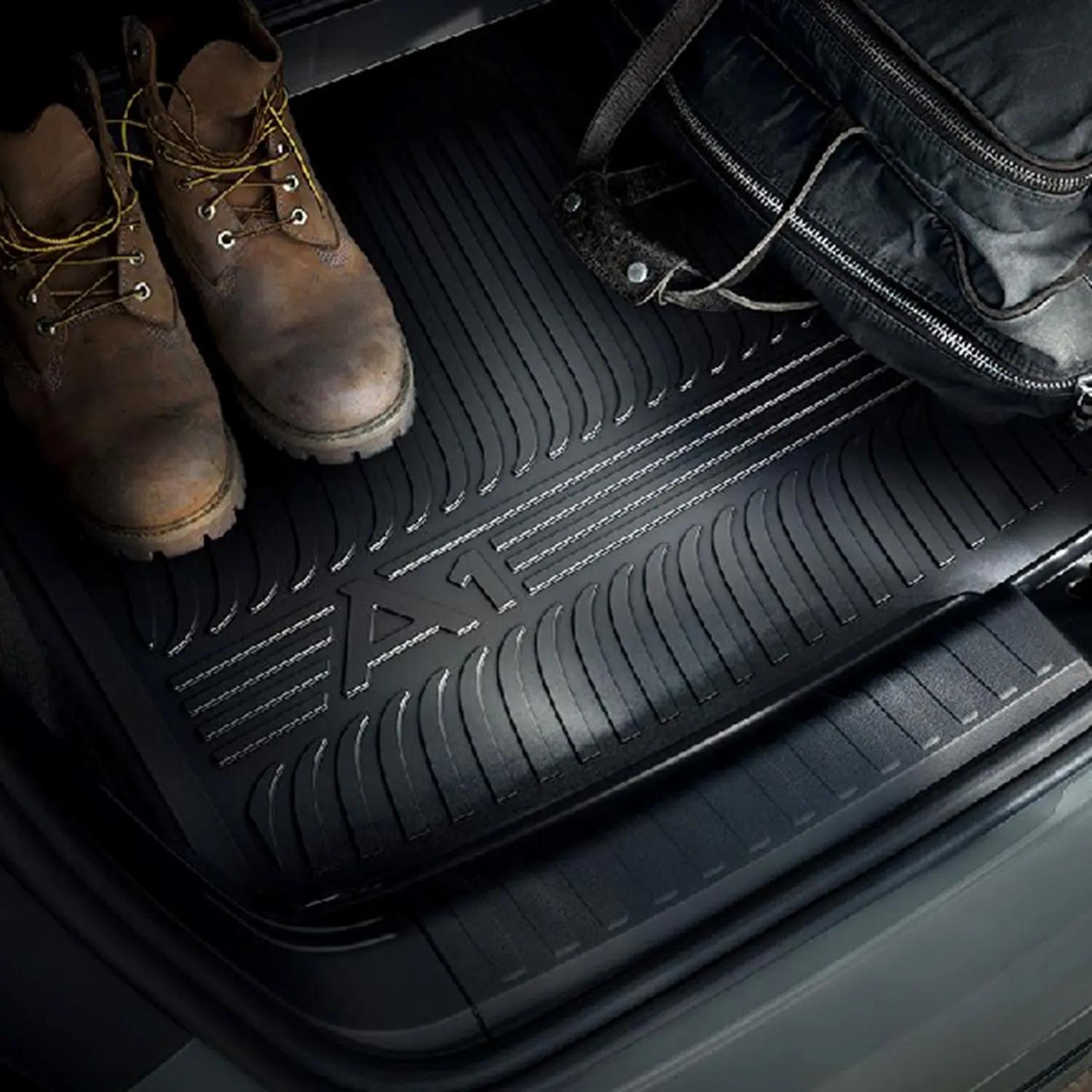 Audi Genuine Boot Liner with boots and bag on top (this specific boot liner is for the Audi A1)