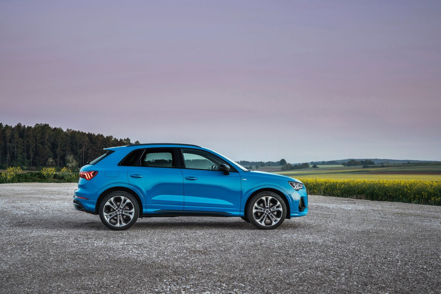 New Audi Q3 TFSI e in blue side view of vehicle