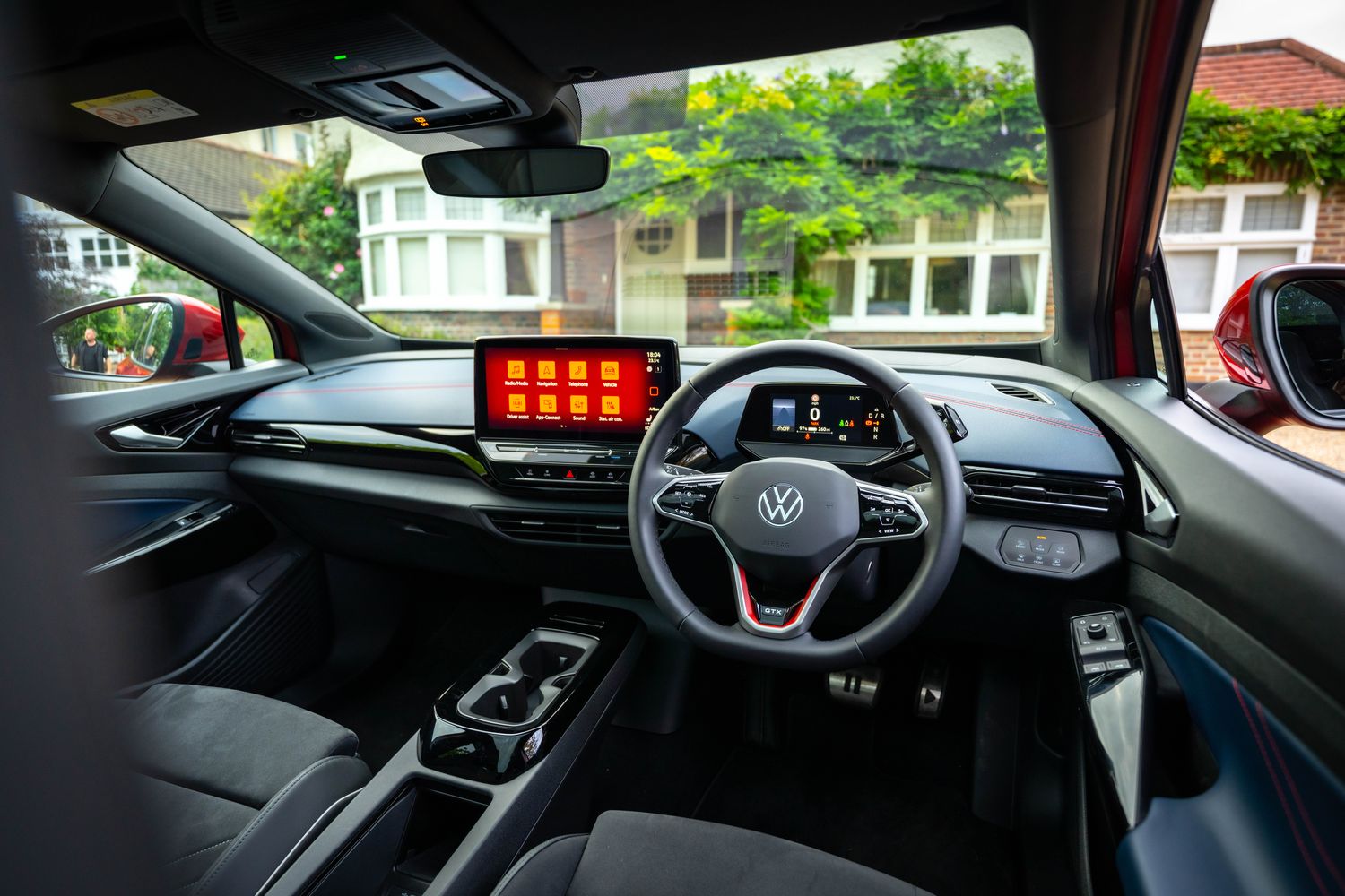 Interior view of the new Volkswagen ID.5, close-up of the front passenger seats, steering wheel and infotainment system