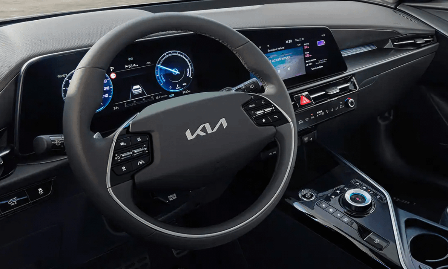 Black Kia Interior, steering wheel and infotainment system