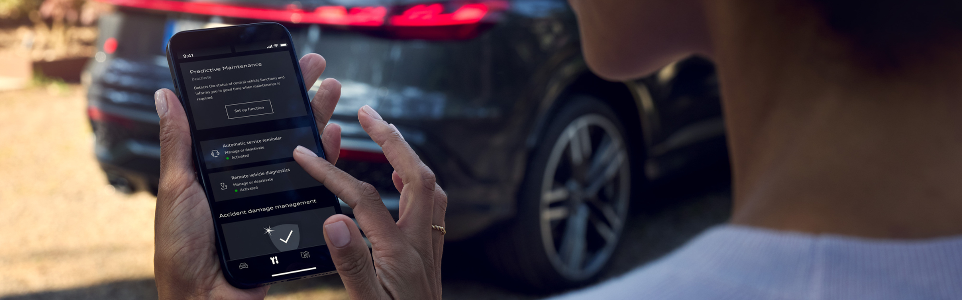 My Audi App image of person browsing the app