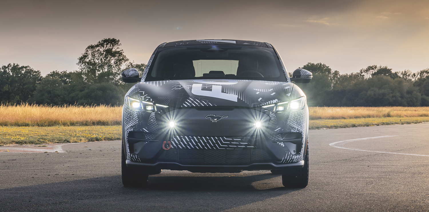 Black Mach-E Rally covered in white decals