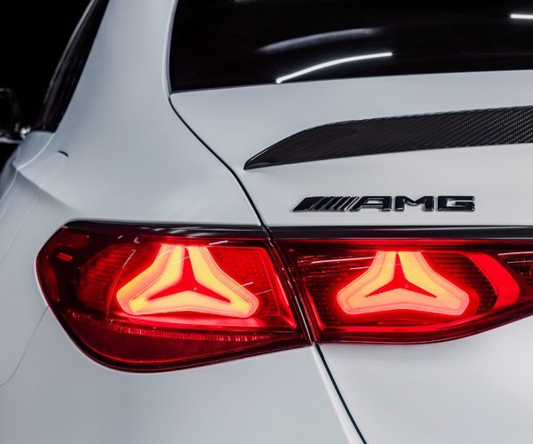 Close up of the rear end of a white Mercedes-Benz AMG.