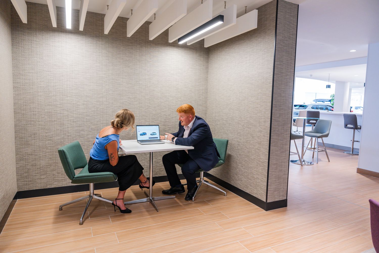 Agnew Leasing specialist speaks to customer about flexible vehicle rental at dealership