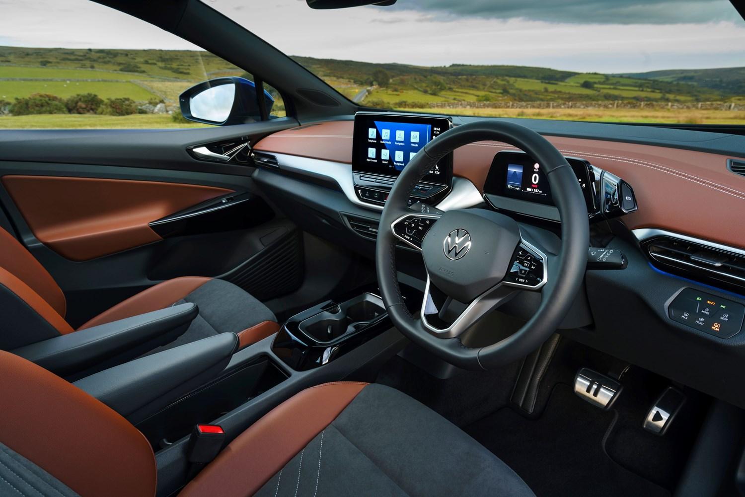 Interior view of the new Volkswagen ID.4, close-up from driver-side of the steering wheel and infotainment system