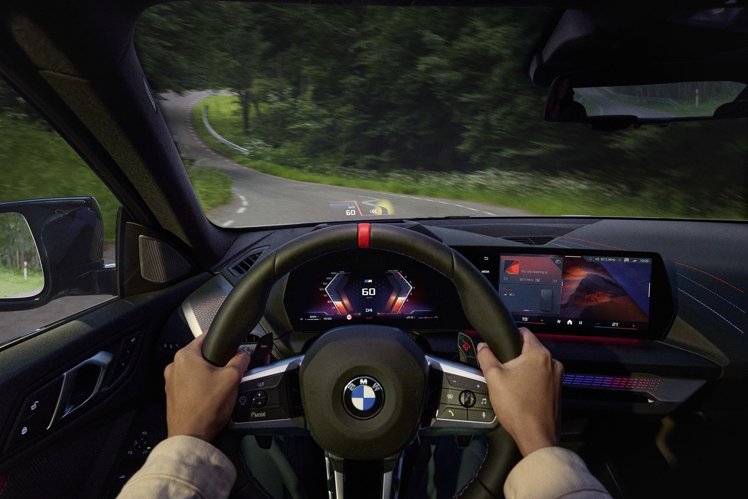 Interior of the BMW 2 Series Gran Coupe featuring head-up display and panoramic glass sunroof.
