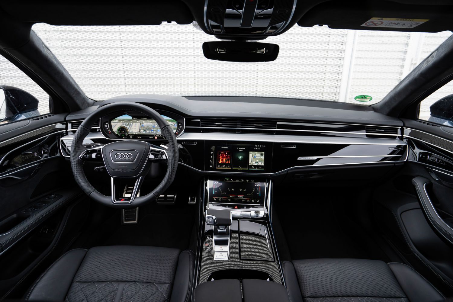 New Audi A8 TFSI e front driver and passenger view of infotainment system
