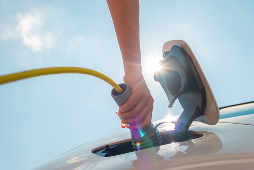 EV Charger being plugged into an electric car