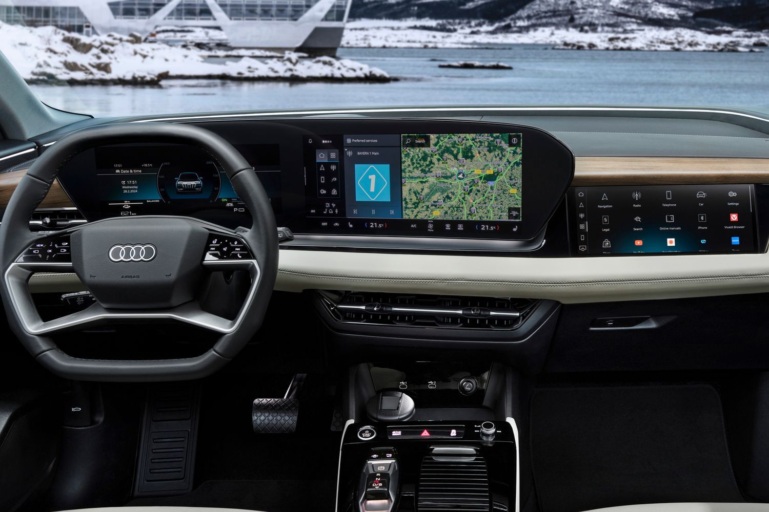 Close up of the Audi Q6 e-tron's curved 14.5-inch panoramic display and 10.9-inch passenger display. 