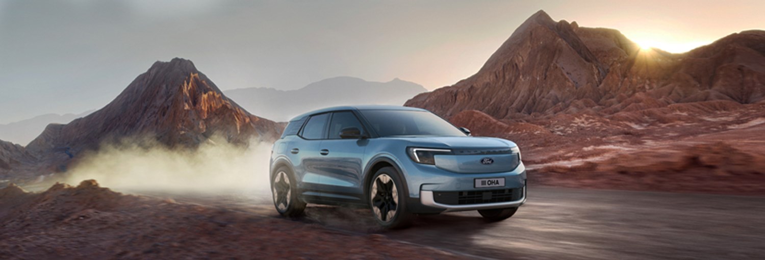 Ford Explorer driving through sandy desert area